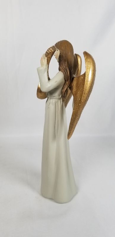 Photo 4 of NEUTRAL TONE DRESS RESIN ANGLE WITH GOLD WINGS PLAYING A GOLD INSTRUMENT 4.5W X 10H INCHES