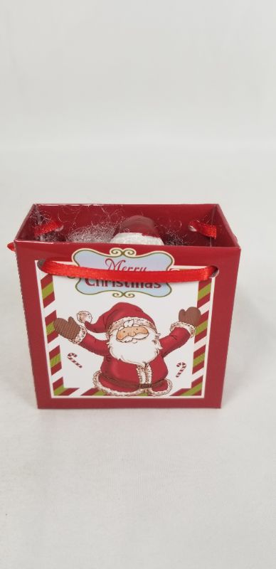 Photo 1 of MINI RESIN SANTA INSIDE A CHRISTMAS GIFT BAG NEW 