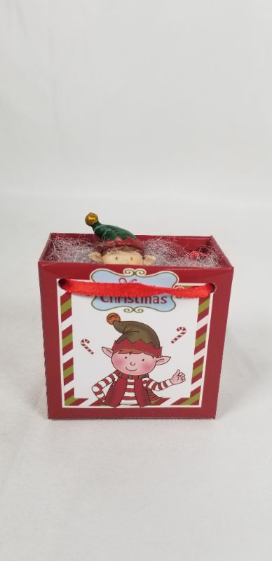 Photo 1 of MINI RESIN SANTA INSIDE A CHRISTMAS GIFT BAG NEW 