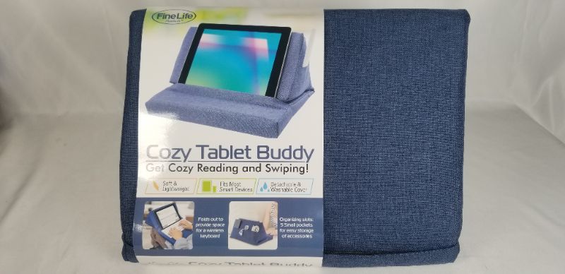 Photo 1 of BLUE COZY TABLET BUDDY, SOFT STAND OFFERS COMFORTABLE EXTENDED USE OF TABLETS AND BOOKS, DETACHABLE AND WASHABLE COVER, FOLDS OUT TO PROVIDE SPACE FOR WIRELESS KEYBOARD AND 5 SMALL POCKETS FOR EASY STORAGE OF ACCESORIES NEW 