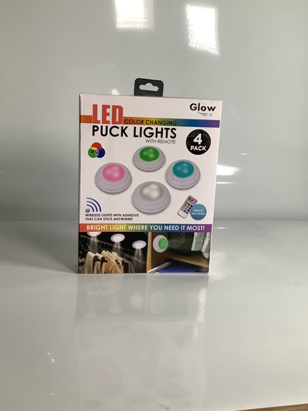 Photo 1 of LED COLOR CHANGING PUCK LIGHTS WITH REMOTE 4 PACK BRIGHT LIGT WHERE YOU IT MOST NEW