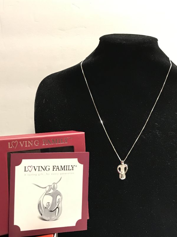 Photo 1 of STERLING SILVER LOVING FAMILY NECKLACE WITH CHARM TW- 5.6 GRAMS