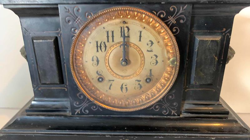 Photo 2 of HEAVY ANTIQUE  BLACK ENAMELED CAST IRON AND BRASS MANTLE CLOCK circa 1882, LION AND GOLD ACCENTS (17” x  8” x H 10.5” )