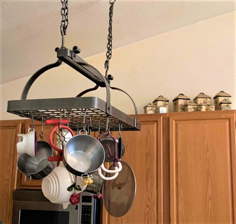 Photo 1 of HEAVY METAL HANGING POT RACK W ITEMS AND CANISTER SET (NOTE: BUYER TO REMOVE)