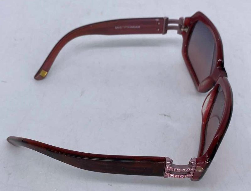 Photo 2 of SUNGLASSES FROM SAKS AND 2 PAIRS READERS