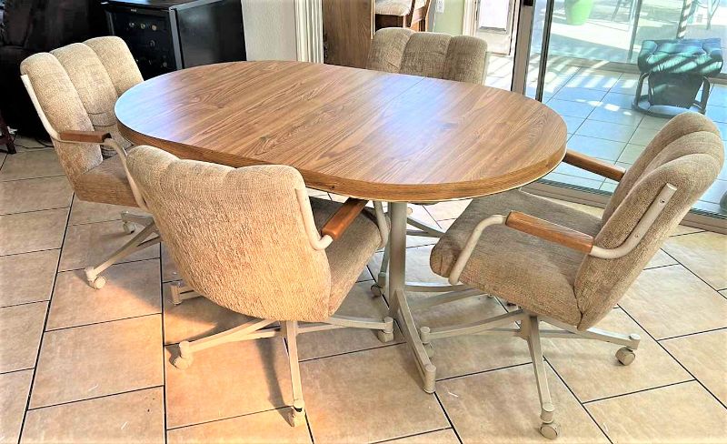 Photo 1 of DINING ROOM TABLE AND FOUR CHAIRS ON WHEELS INCLUDES 1 LEAF TOTAL WIDTH WITH 11.5” LEAF IS 59” x 36”