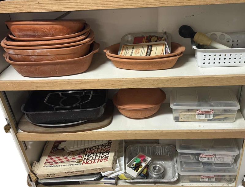 Photo 1 of CONTENTS OF CABINET- CLAY COOKING