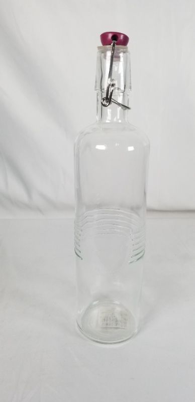 Photo 1 of OLD FASHION CLIP TOP CRUET EMBOSSED CLEAR GLASS 24 OZ NEW