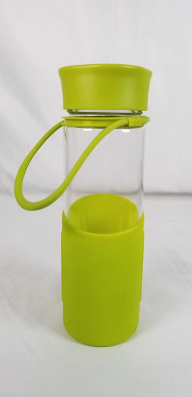 Photo 3 of CLEAR GLASS WATER BOTTLE WITH GREEN SILICONE BOTTOM AND PLASTIC TOP 2.5D X 8.5H INCHES NEW