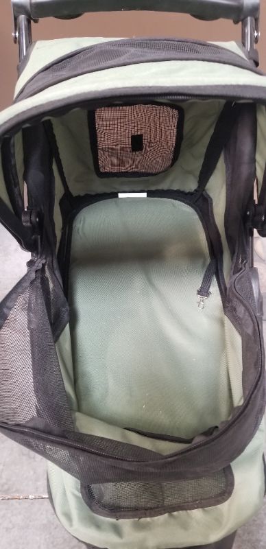 Photo 7 of GREEN AND BLACK 3 WHEEL PET STROLLER  WITH 2 CUP HOLDERS AND AN UNDER BASKET USED 