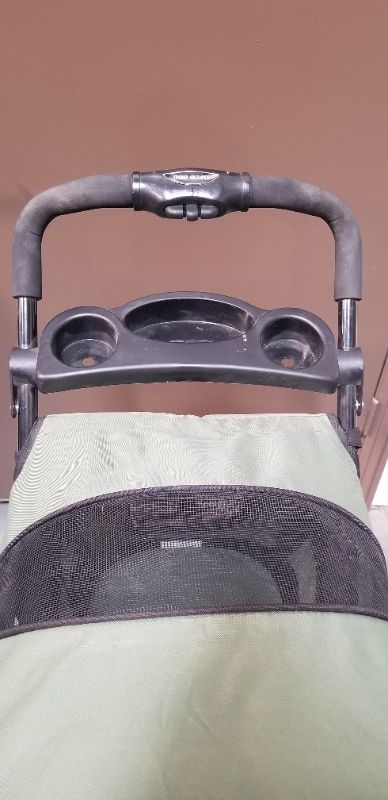 Photo 8 of GREEN AND BLACK 3 WHEEL PET STROLLER  WITH 2 CUP HOLDERS AND AN UNDER BASKET USED 