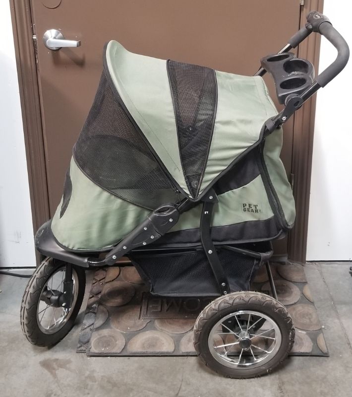 Photo 6 of GREEN AND BLACK 3 WHEEL PET STROLLER  WITH 2 CUP HOLDERS AND AN UNDER BASKET USED 