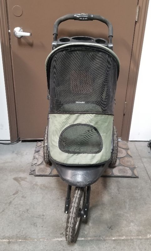 Photo 5 of GREEN AND BLACK 3 WHEEL PET STROLLER  WITH 2 CUP HOLDERS AND AN UNDER BASKET USED 