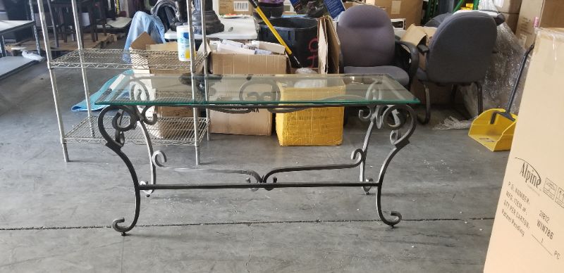 Photo 2 of WROUGHT IRON TABLE WITH GLASS TOP  56L X 18W X 28H INCHES USED