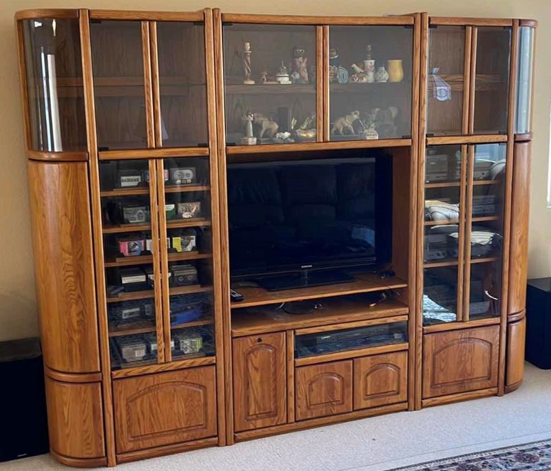 Photo 1 of WOOD BASE ENTERTAINMENT CENTER W GLASS SHELVES 101” X 20” H78”