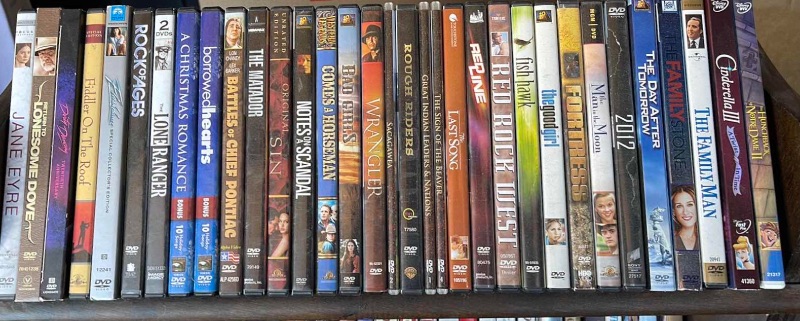 Photo 2 of DVDS W/ STAND MOSTLY WATCHED ONCE OR NEW 