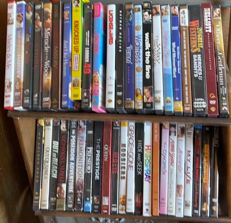 Photo 1 of DVDS W/ STAND MOSTLY WATCHED ONCE OR NEW 