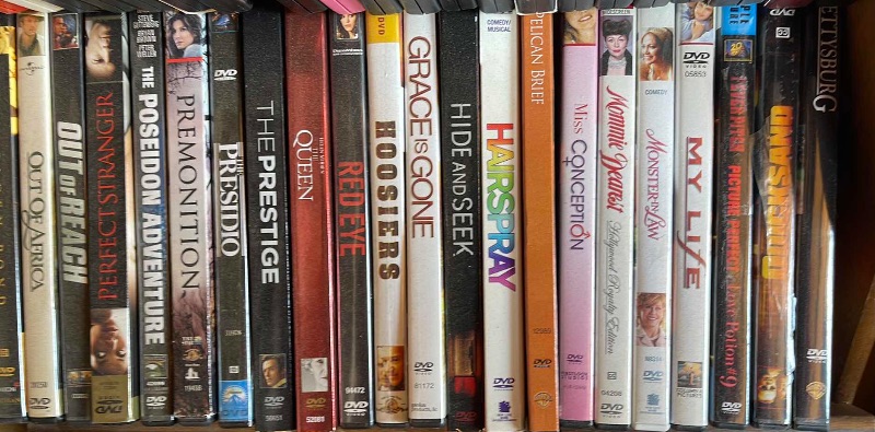 Photo 2 of DVDS W/ STAND MOSTLY WATCHED ONCE OR NEW 