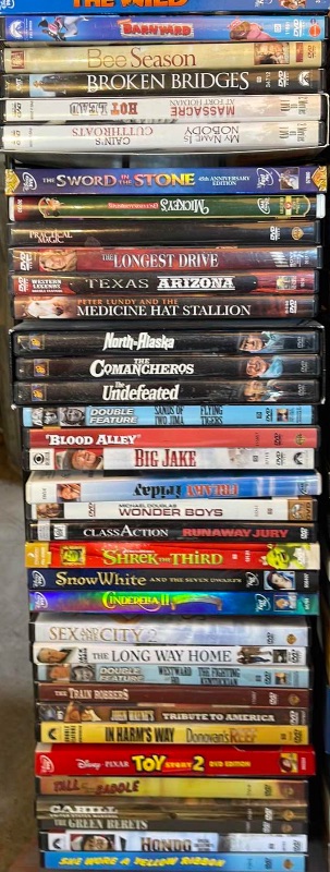 Photo 2 of DVDS W/ STAND MOSTLY  WATCHED ONCE OR NEW 