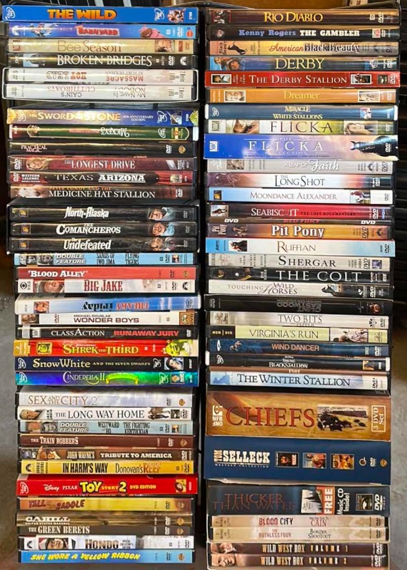 Photo 1 of DVDS W/ STAND MOSTLY  WATCHED ONCE OR NEW 