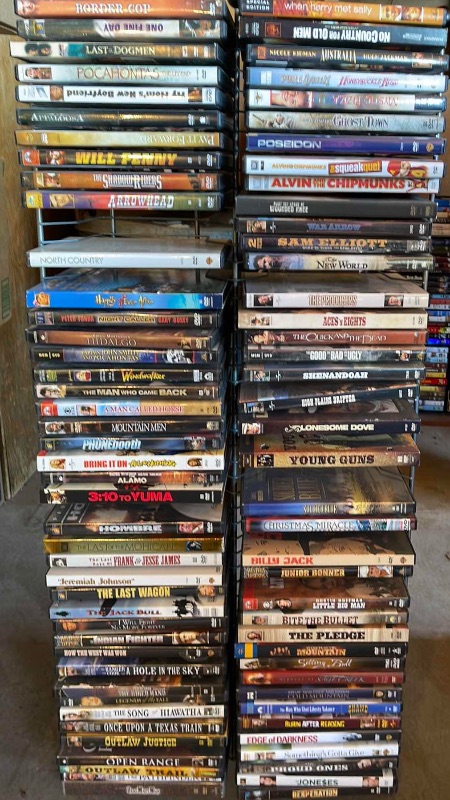 Photo 1 of DVDS W/ STAND MOSTLY WATCHED ONCE OR NEW