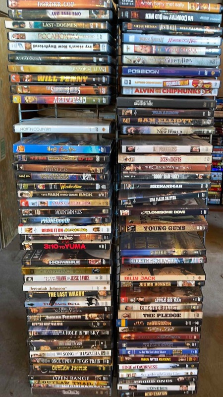 Photo 1 of DVDS W/ STAND MOSTLY NEW OR WATCHED ONCE