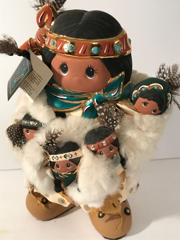 Photo 1 of “FROM THE HEART OF IDAHO”
NATIVE AMERICAN STYLE FIGURE WITH BABIES -
FUR TRIMMED 
13.5”