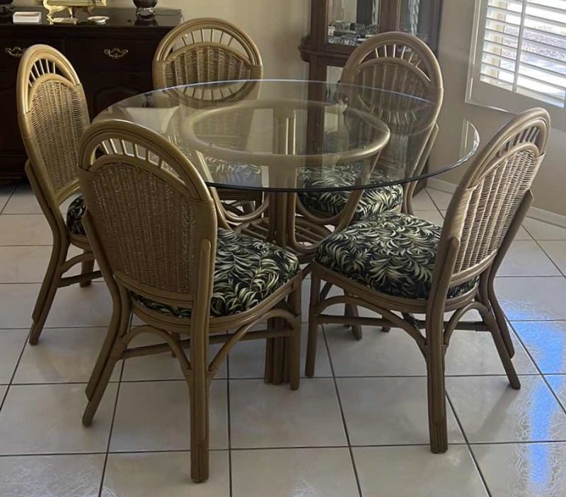 Photo 1 of 48” ROUND GLASSTOP CANE BASE TABLE  W 5 SIDE CHAIRS COVERED IN BLACK & GREEN LEAF UPHOLSTERY (H30")