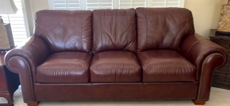 Photo 1 of BURGUNDY LEATHER SOFA W BRASS TACK TRIM 87” x 38”