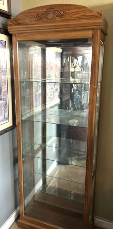 Photo 1 of LIGHTED WOOD CURIO CABINET WITH GLASS SHELVES  27” x 12” x H75 1/2”