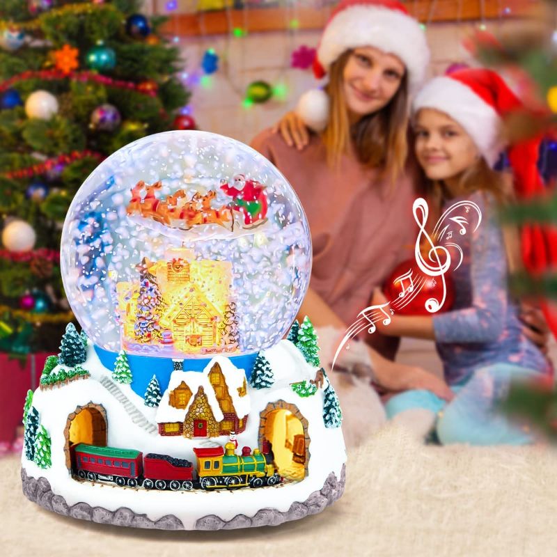 Photo 1 of Musical Rotating Santa Claus with Train in Village Glitter, Christmas Music Box Snow Globe Gift, for Women Wife Mom Girlfriend Daughter Son Granddaughter, Xmas Present Play 64 Songs