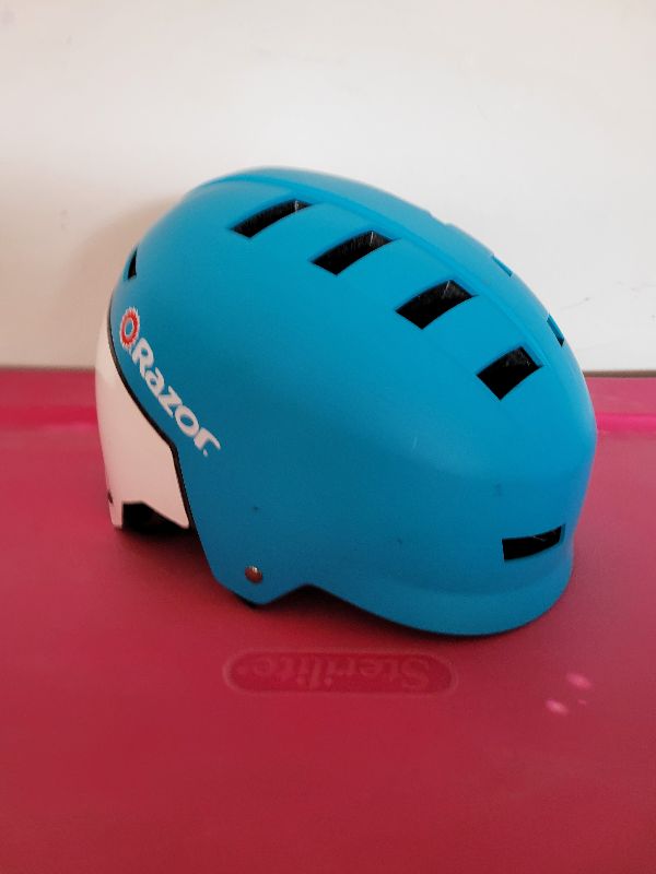 Photo 1 of KIDS RAZOR SKATEBOARD AND BICYCLE HELMET SIZE MEDIUM