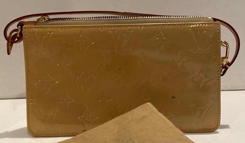 Photo 3 of LOUIS VUITTON MONOGRAM POUCH W DUST COVER (AUTHENTICITY NOT VERIFIED)