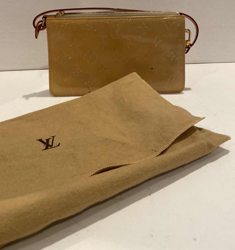 Photo 1 of LOUIS VUITTON MONOGRAM POUCH W DUST COVER (AUTHENTICITY NOT VERIFIED)