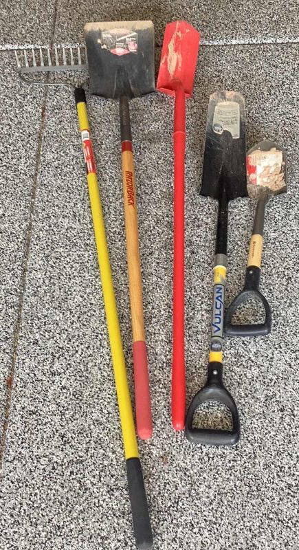 Photo 1 of DIFFERENT SHOVELS AND A METAL RAKE