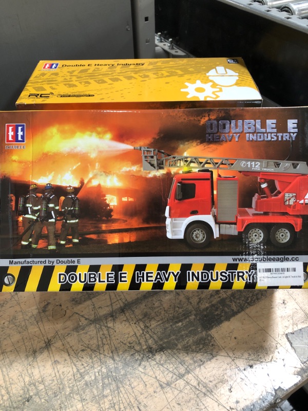 Photo 2 of DOUBLE E Remote Control Fire Truck 10 Channel Water Pump 18 Inch Extendable Ladder Fire Engine with Working Sounds Lights Rechargeable 2.4GHz Toy Trucks for Kids