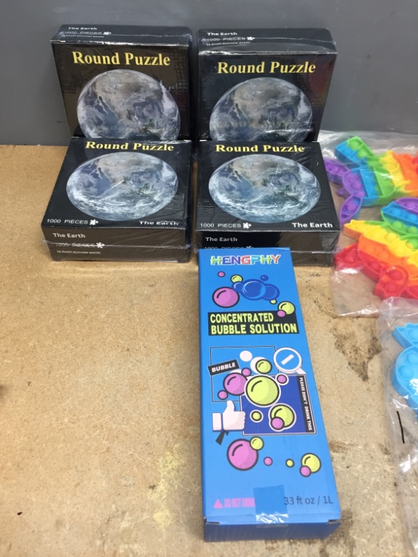 Photo 1 of ***NON-REFUNDABLE***
ASSORTED FUN BUNDLE
4 1000 PIECE ROUND PUZZLES OF THE EARTH, 12 PIECES OF POP IT FIDGIT TOYS, 33 OZ BUBBLE SOLUTION