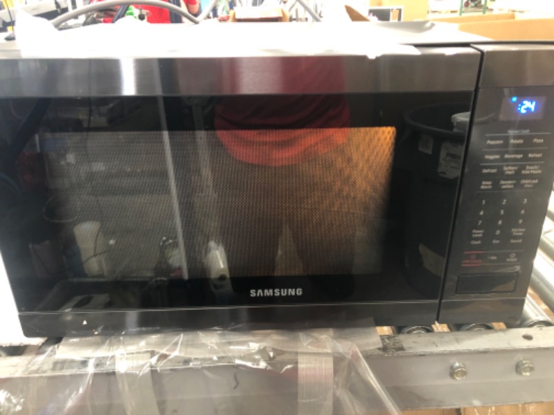 Photo 7 of (UNABLE TO OPEN DOOR; MAJOR DENTS) 
Samsung MS19M8000AG MS19M8000AG/AA Large Capacity Countertop Microwave Oven, Black Stainless Steel, 1.9
