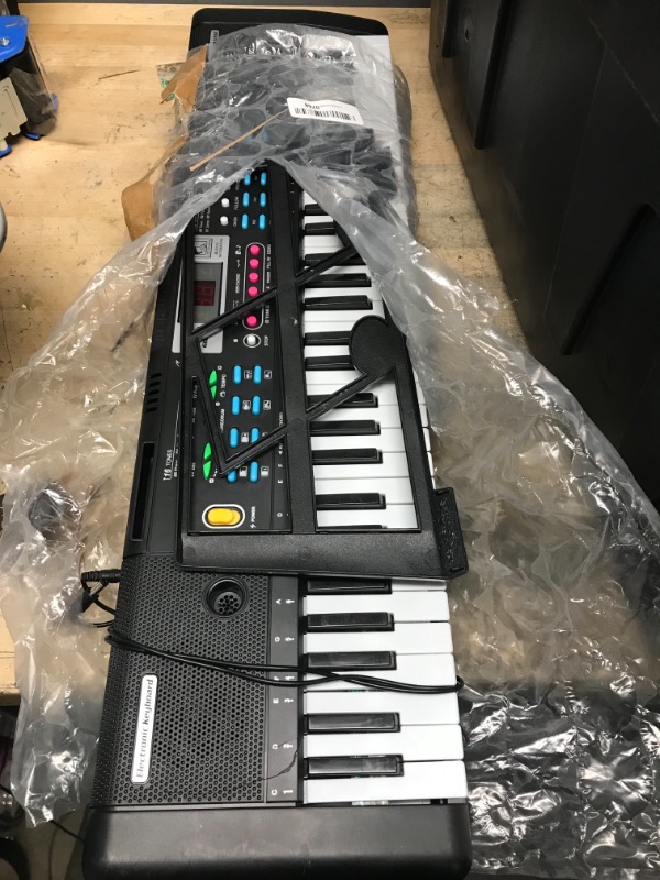 Photo 2 of *NONFUNCTIONAL* Tencoz Electronic Keyboard Piano 61 Keys, Portable Piano Keyboard with Music Stand, Microphone, Power Supply Digital Music Piano Keyboard Early Education Music Instrument for Beginners & Kids
