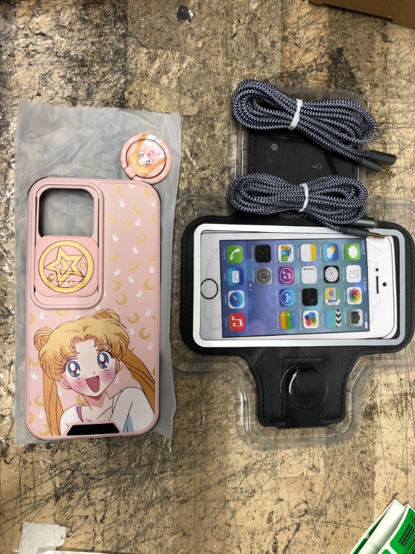 Photo 1 of ***3 Item bundle**** iphone 13pro max Sailor Moon case, two headphone extension aux cords and iphone work out band