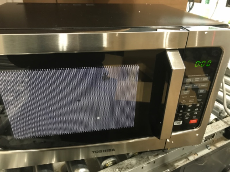 Photo 2 of ****TESTED/ TURNS ON*** TOSHIBA EM131A5C-SS Countertop Microwave Oven, 1.2 Cu Ft with 12.4" Turntable, Smart Humidity Sensor with 12 Auto Menus, Mute Function & ECO Mode, Easy Clean Interior, Stainless Steel & 1100W Silver Microwave Oven