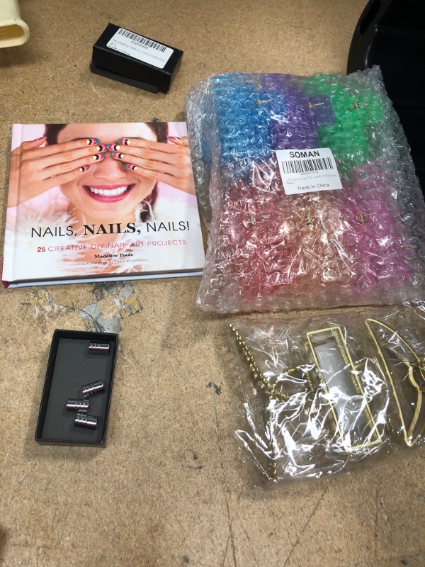 Photo 1 of **NO REFUNDS/RETURNS*- Bundle of assorted HAIR CLIPS, Nail Book
