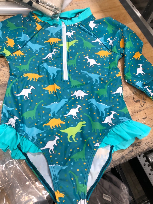 Photo 1 of LITTLE GIRLS 2 PIECE DINOSAUR LOLNG SLEEVE SWIMSUIT SIZE MEDIUM