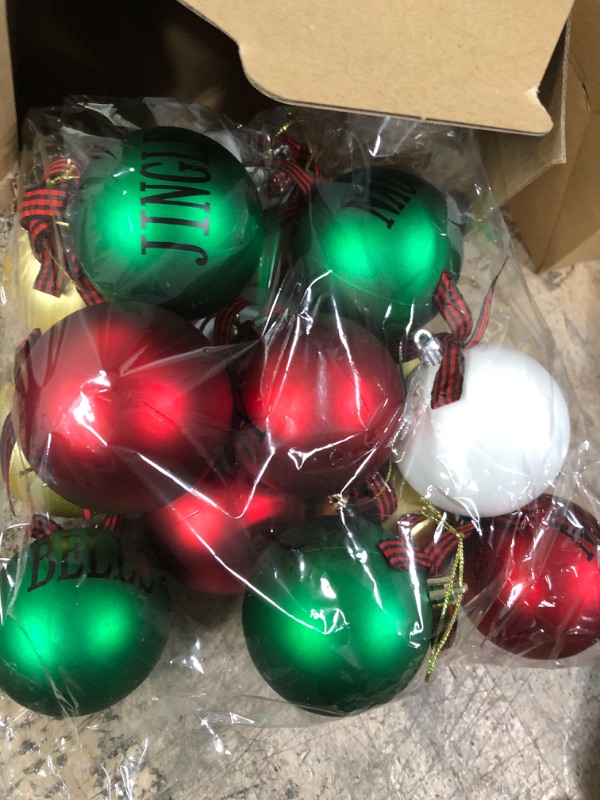 Photo 1 of 16 Pieces Christmas Ball Hanging Ornament Buffalo Plaid Xmas Tree Ornaments Matte Christmas Word Hanging Decoration with Bows for Farmhouse Party Supply (Black Red Plaid, White and Green Ball, 3 Inch) 