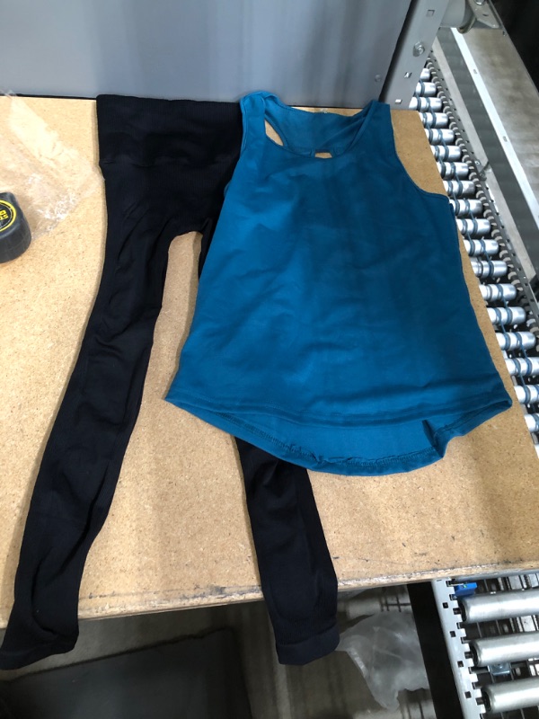 Photo 1 of BLACK LEGGINGS SIZE SMALL 
AND
TEAL WORKOUT SHIRT SIZE M