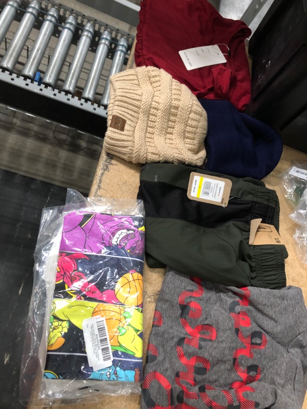 Photo 1 of **NO REFUNDS/RETURNS** -Bundle of Assorted mens/womens clothes multiple sizes/colors 
