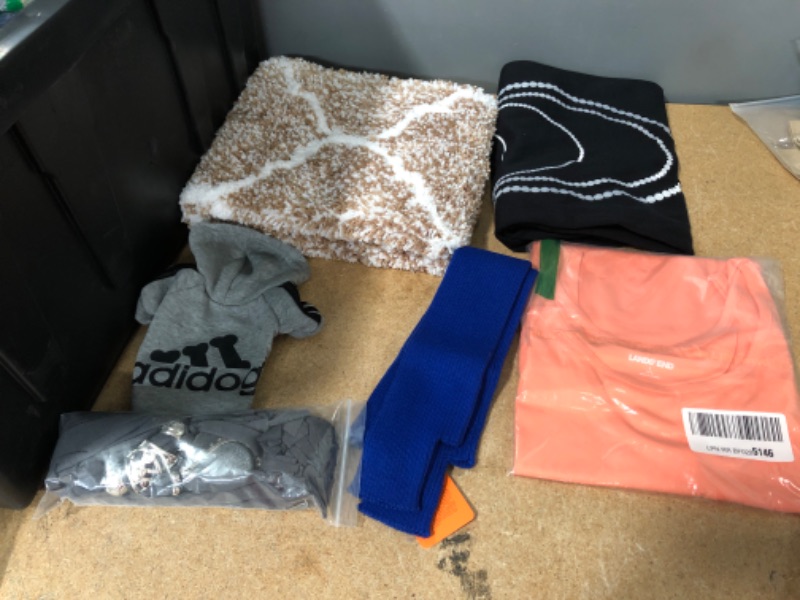 Photo 1 of Bundle of Assorted clothing items 
