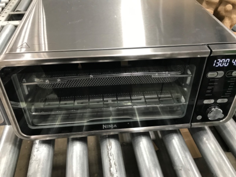 Photo 4 of Ninja SP301 Dual Heat Air Fry Countertop 13-in-1 Oven with Extended Height, XL Capacity, Flip Up & Away Capability for Storage Space, with Air Fry Basket, SearPlate, Wire Rack & Crumb Tray, Silver
