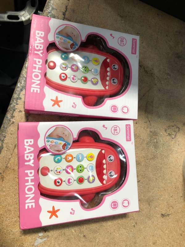 Photo 2 of PACK OF TWO- Baby Shark Cell Phone Toy with Removable Teether Case, Light up, Music & Adjustable Volume Kids Play & Learn Fake Phone 
