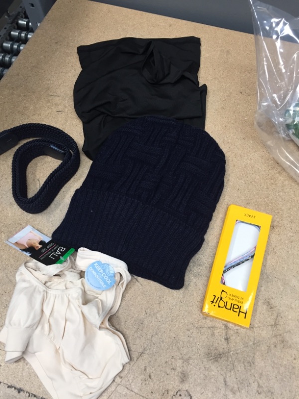 Photo 1 of **MISC** CLOTHING BUNDLE, 
1 MED SIZED BRA
2 NECK FACE COVERING SCRAFS
1 SMALL BLUE BELT
1 PACK OF EYE GLASS RETAINERS
1 WINTER HAT